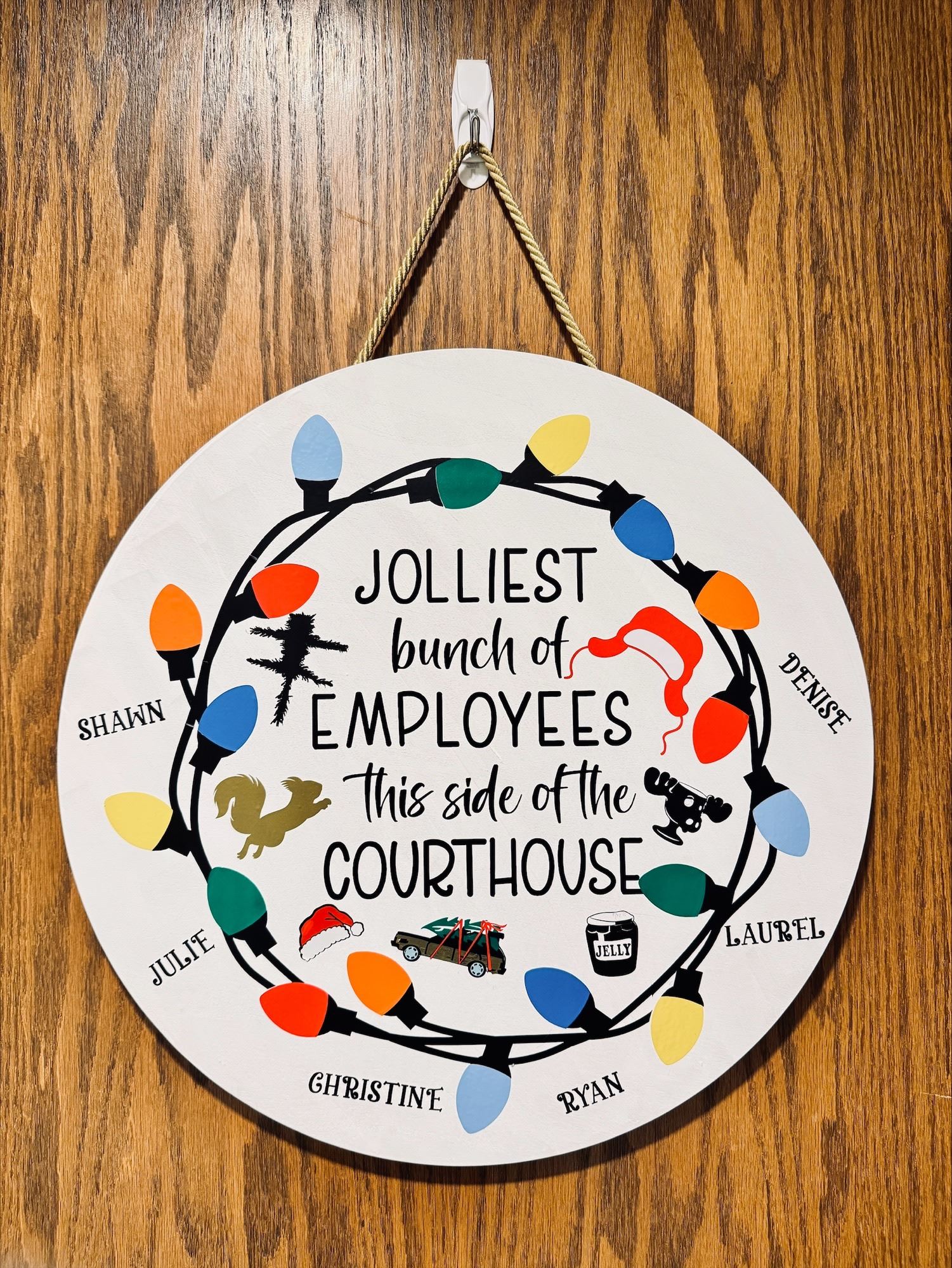 sign that reads "jolliest bunch of employees this side of the courthouse"