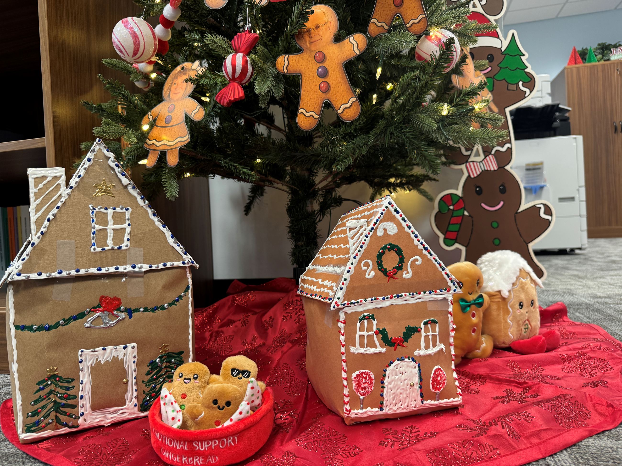 Gingerbread houses made of cardboard under a tree