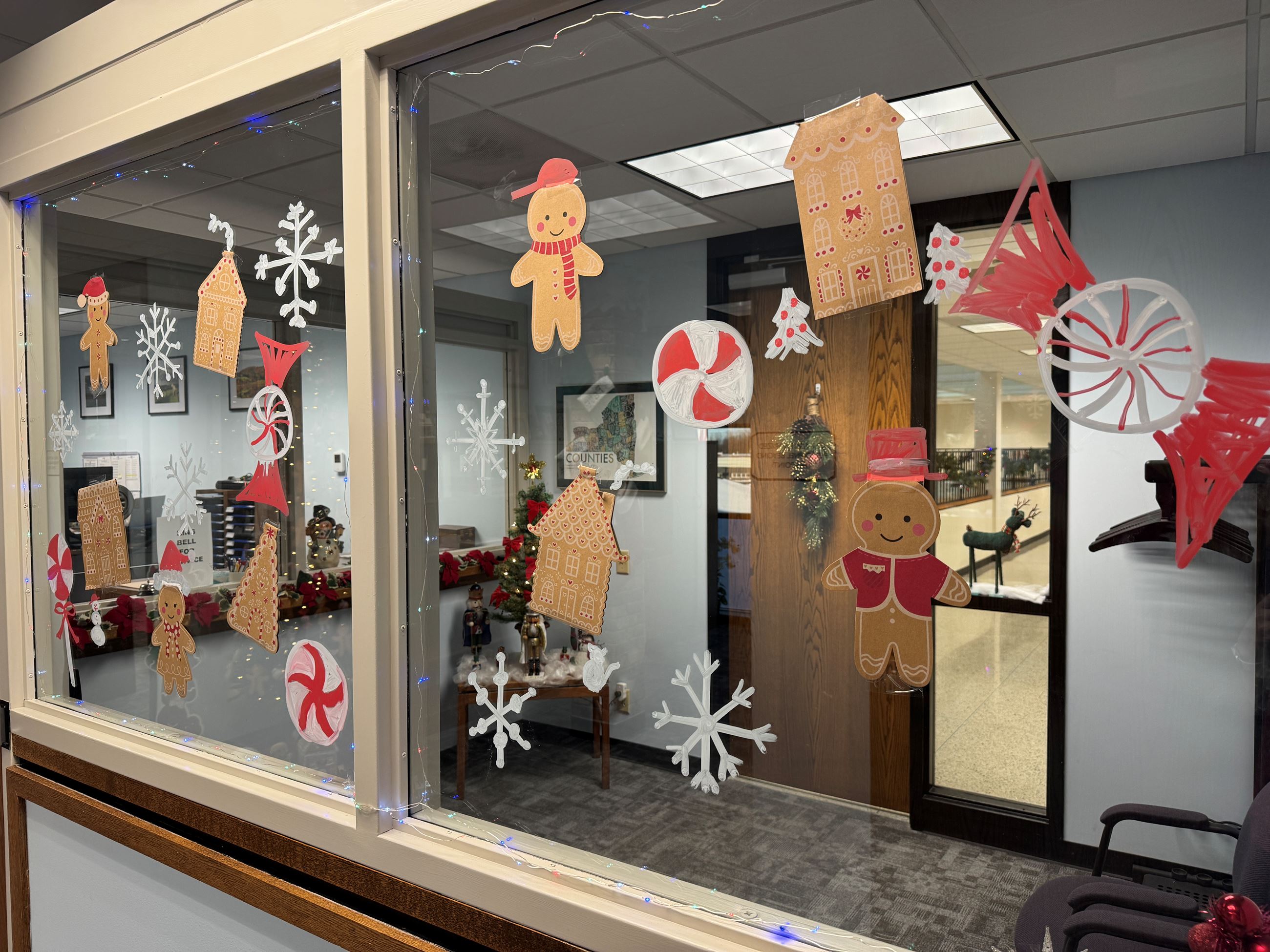 Gingerbread men and houses drawn on an interior window