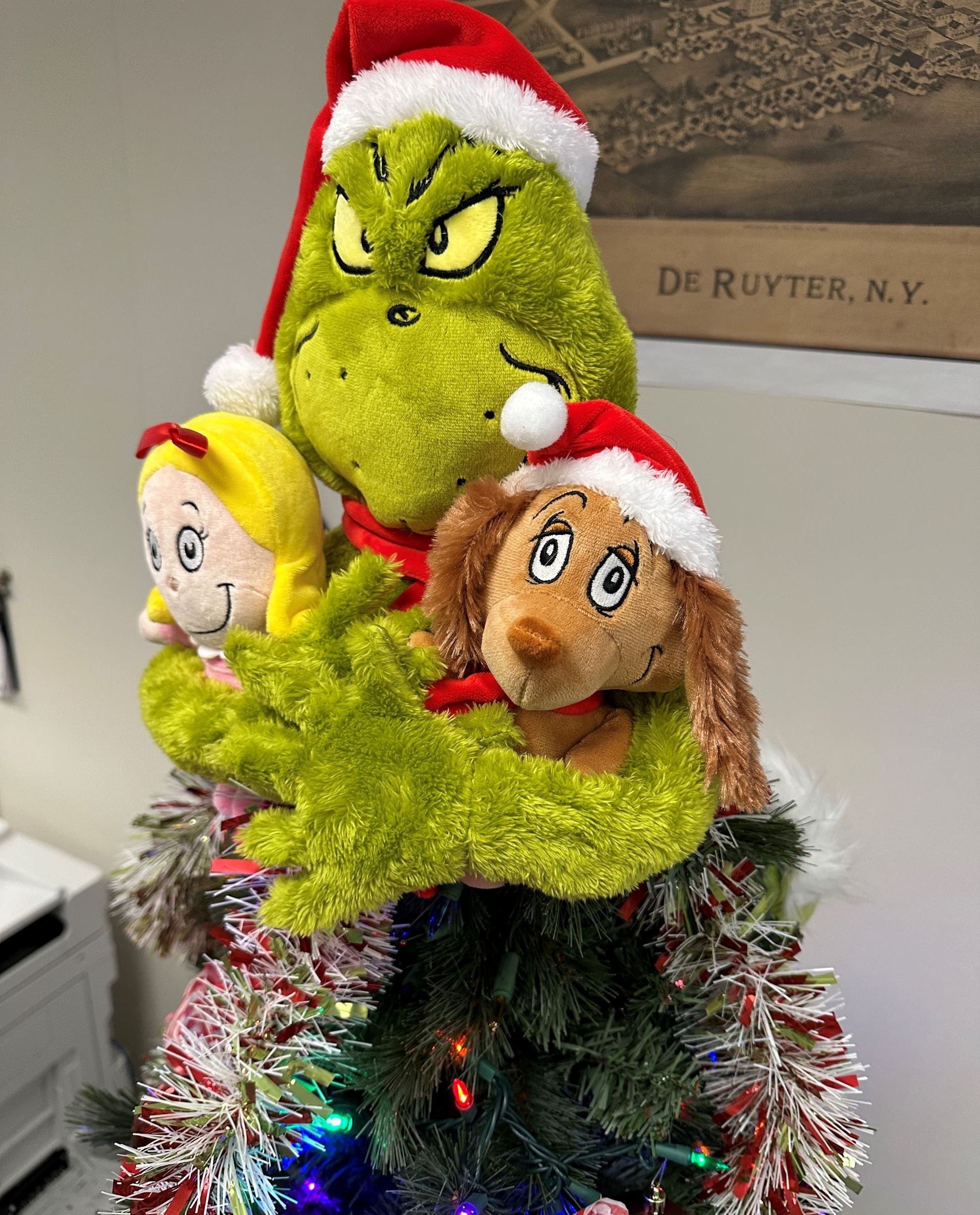 Close up of Grinch Christmas tree topper