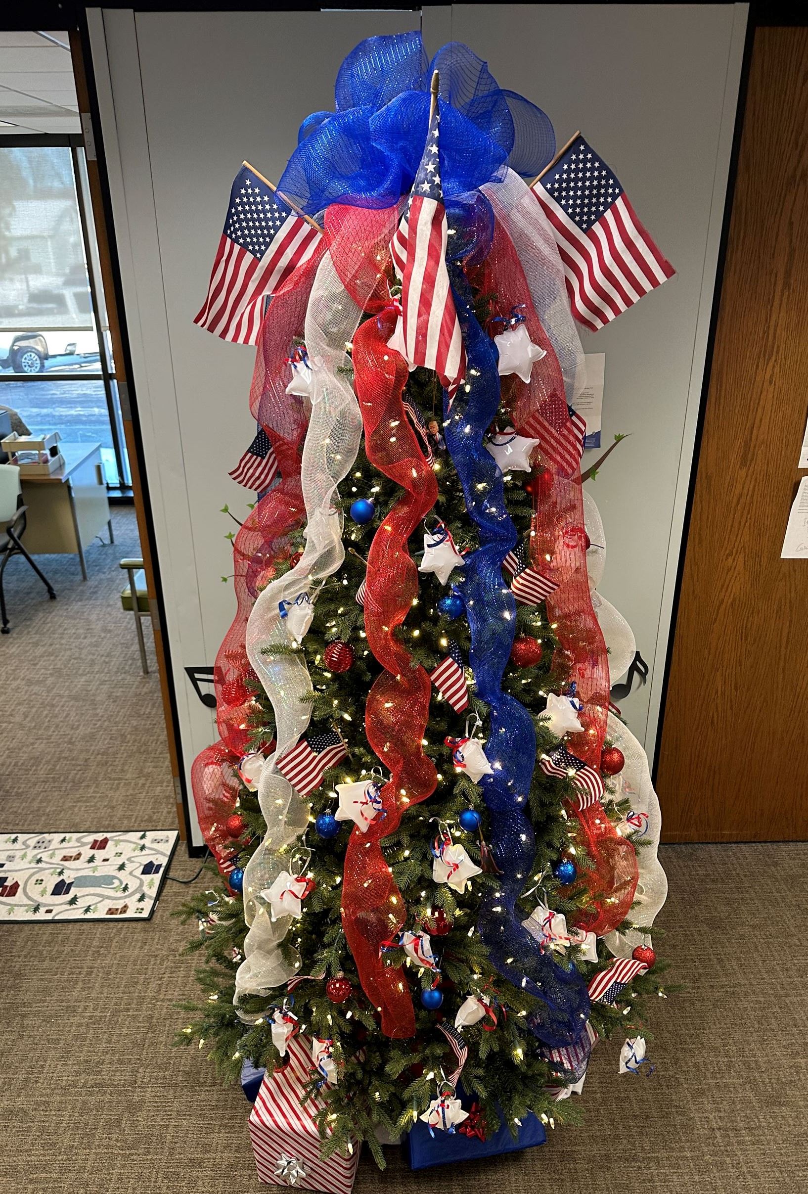 Christmas Tree decorated red, white, and blue