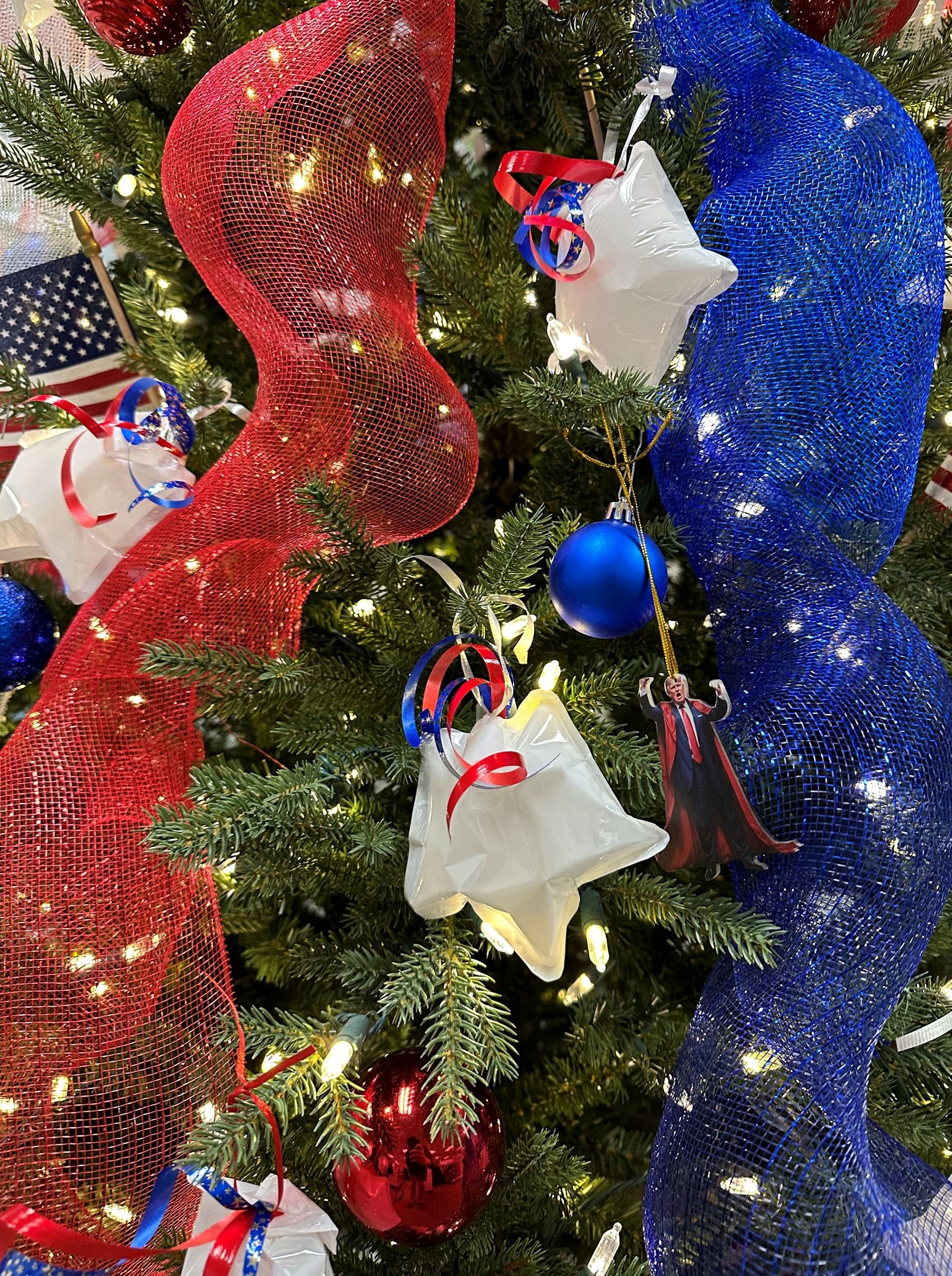 Close up of star ornaments on red, white and blue tree