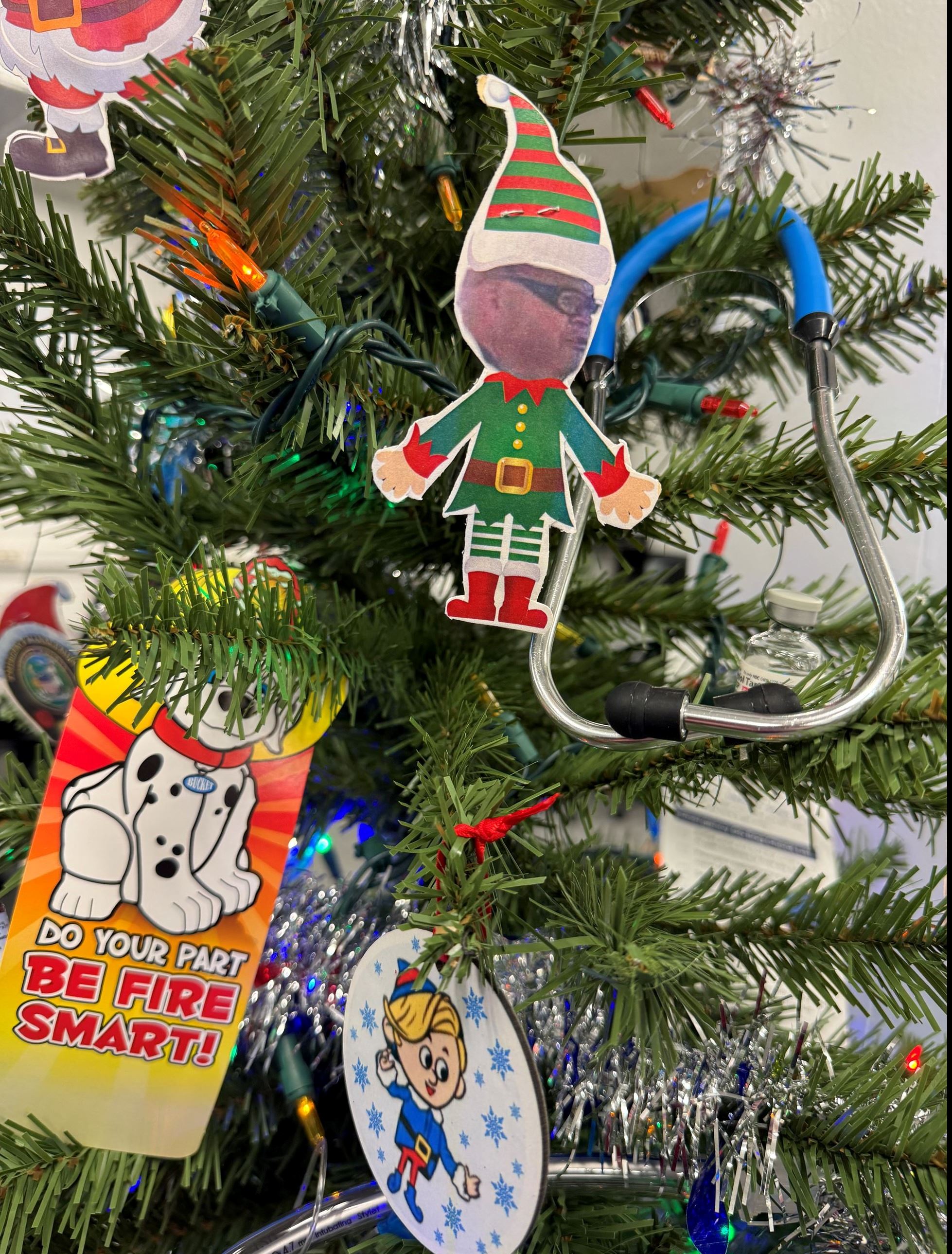 Close up of ornaments and stethoscope on Christmas Tree