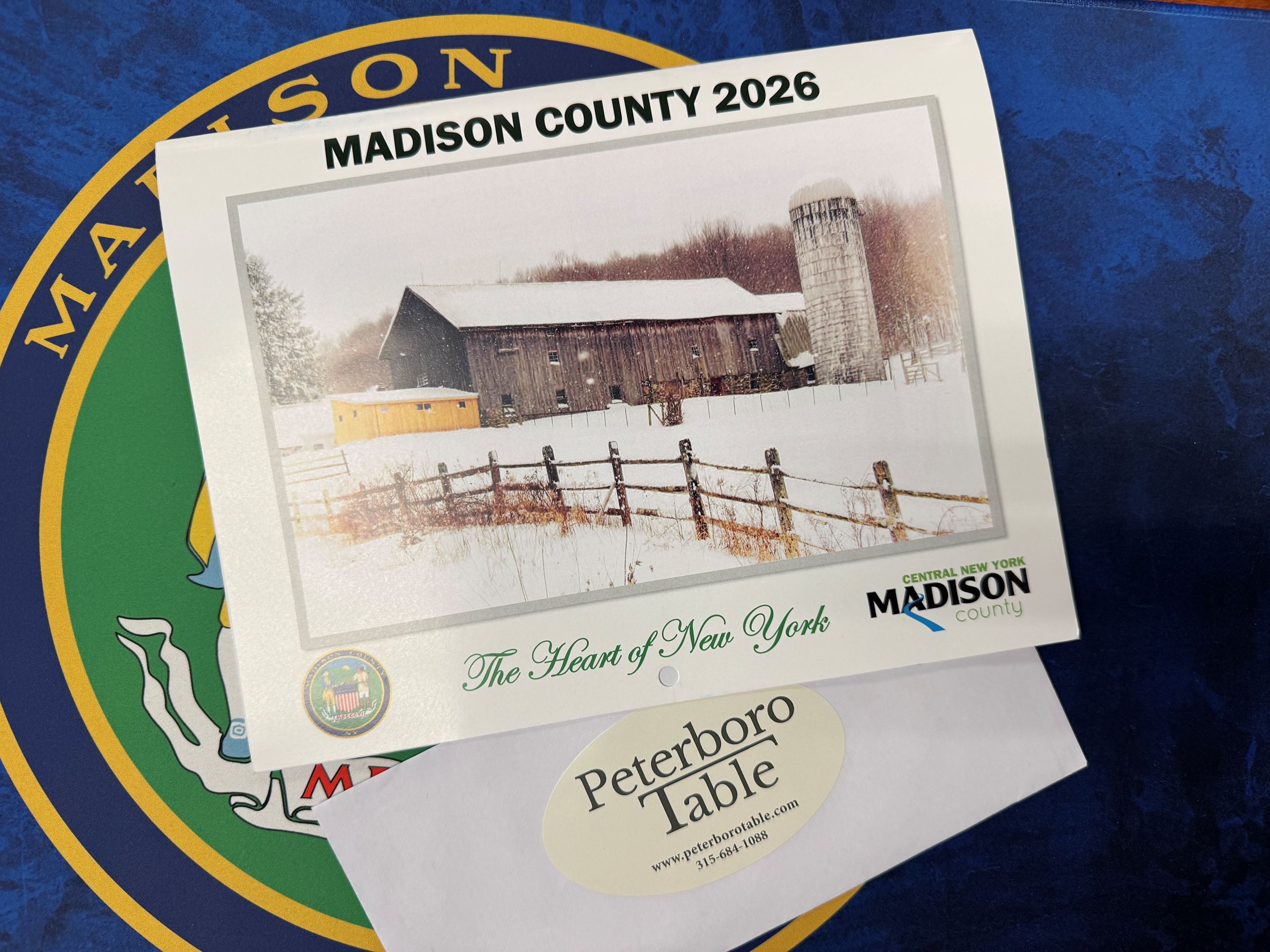 image of Madison County 2026 calendar laying on a blue background